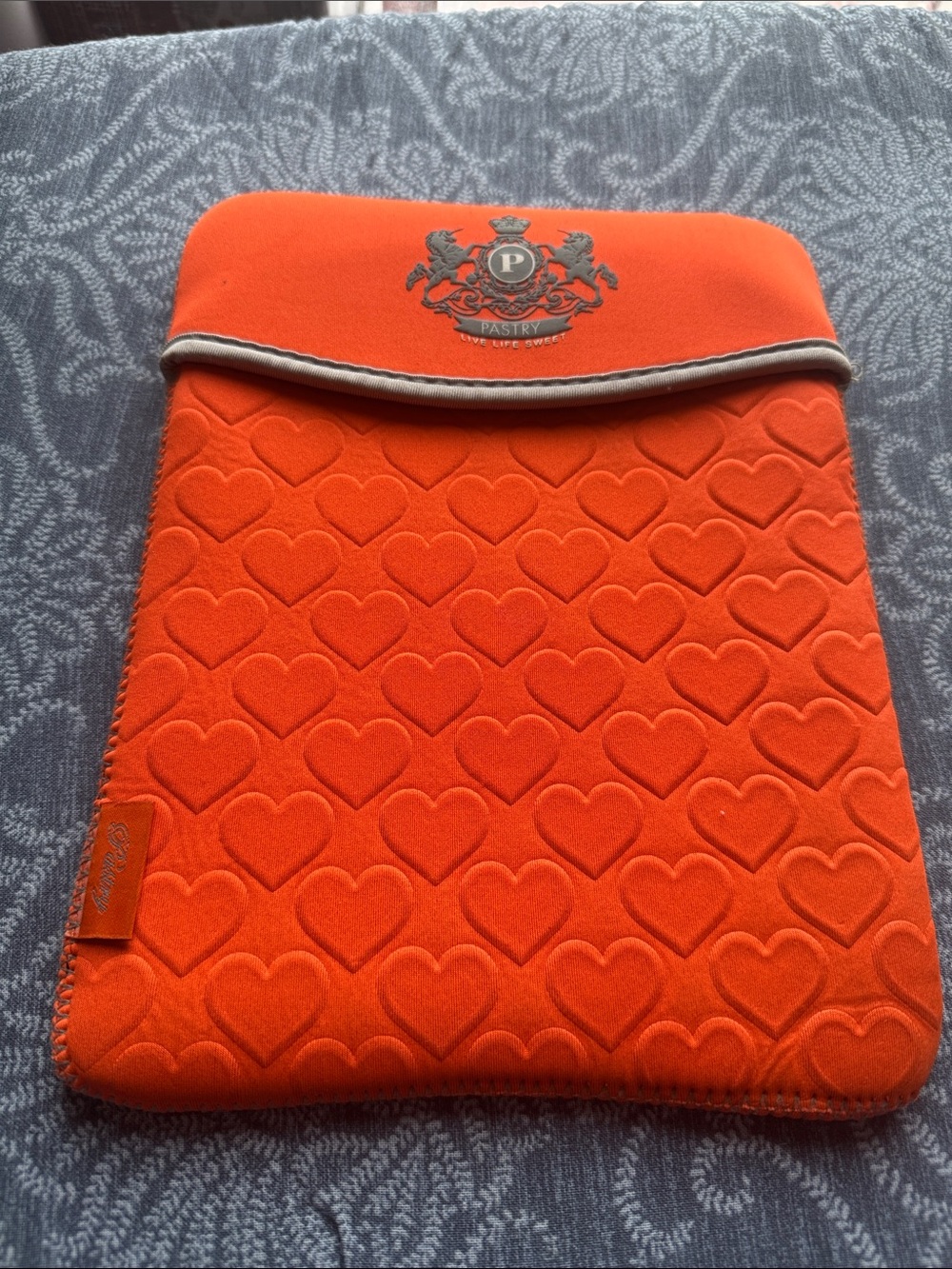Pastry Orange Tablet Sleeve with Heart Embossed Design